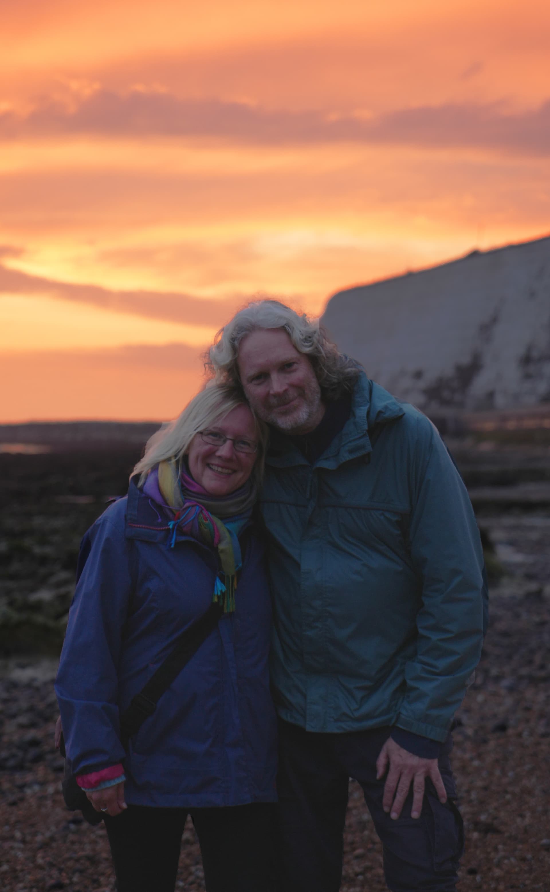 Couple at sunset by the cliffs
